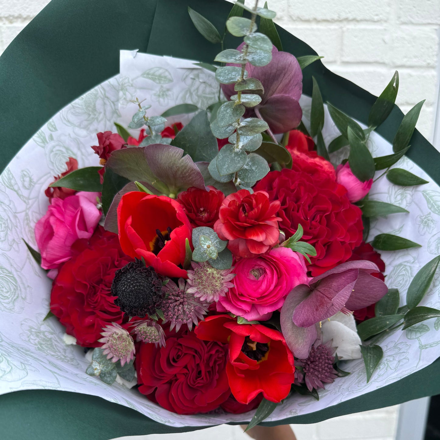 Bouquet of modern red and pink garden-style Valentine's Day flowers for flower delivery in Pittsburgh PA.
